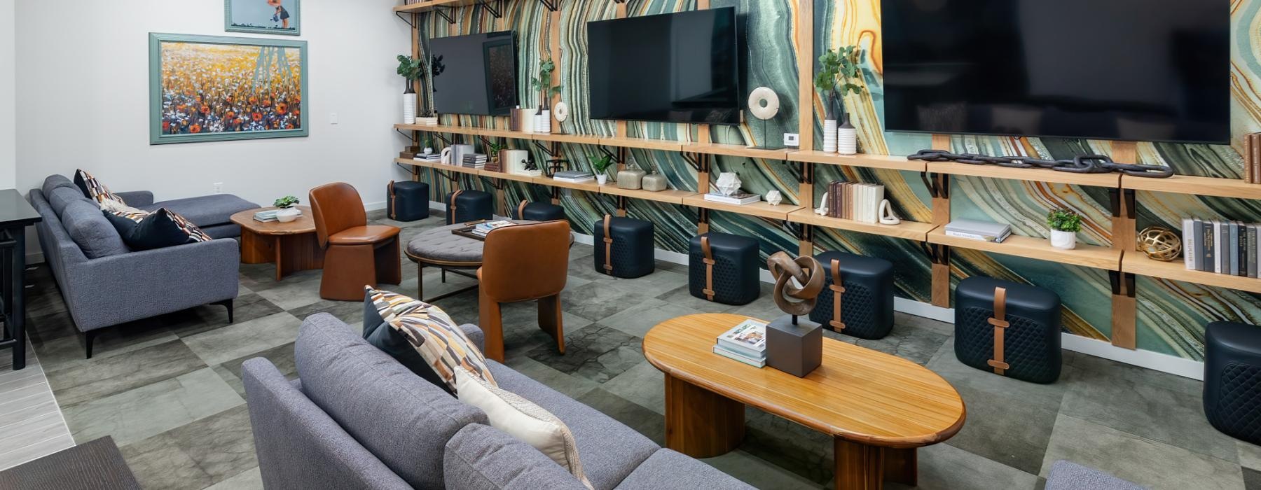 clubhouse with couches and tvs
